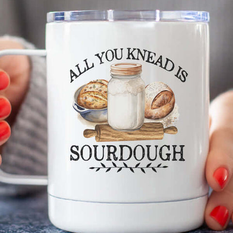 All You Knead Coffee Cup featuring a design with sourdough elements and a mason jar on a wood background.