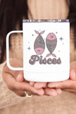 Pisces zodiac coffee cup featuring fish design, perfect for astrology lovers, held in hands.