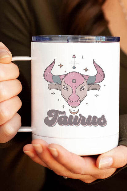 Taurus Zodiac coffee cup with a stylish bull design held by a person, perfect for morning coffee on the go.