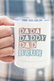 Dada Daddy Bruh Cup featuring playful text design held by a person in a plaid shirt.