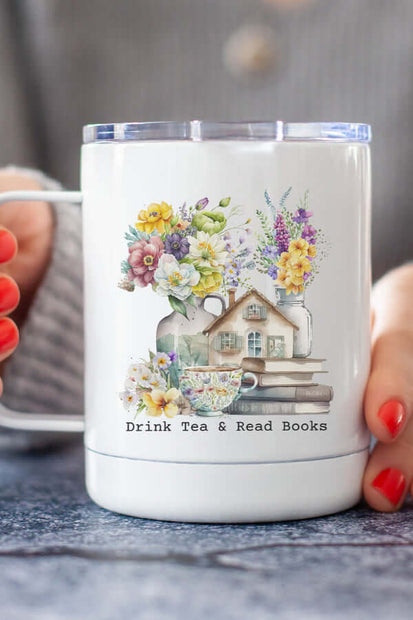 Drink Tea Travel Cup with floral design and text 'Drink Tea & Read Books' held by person.