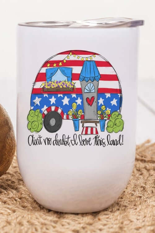 Patriotic Camper Wine Cup featuring a colorful vintage trailer design with the phrase 'Ain't no doubt, I love this land!'