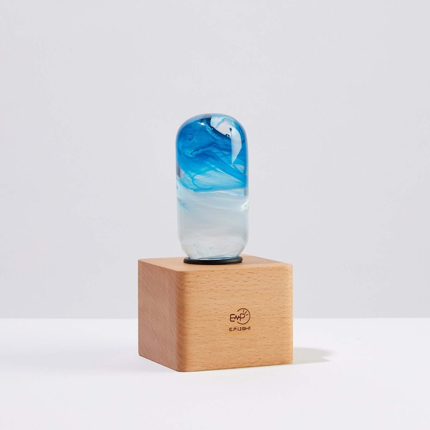 Elegant Blue Lamp on a wooden base showcasing a stylish design and vibrant colors, ideal for warm ambient lighting.