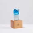Elegant Blue Lamp on a wooden base showcasing a stylish design and vibrant colors, ideal for warm ambient lighting.