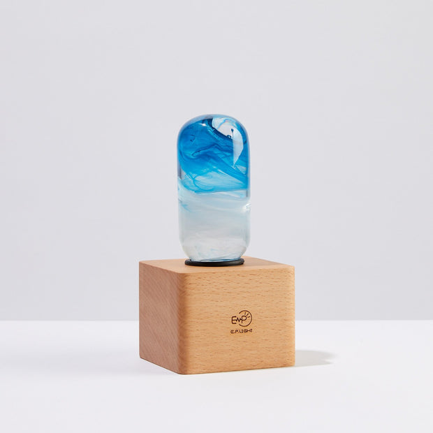 Elegant Blue Lamp on a wooden base showcasing a stylish design and vibrant colors, ideal for warm ambient lighting.