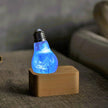 Blue Swirl Glass Decorative Light Bulb with Wooden and Metal Base