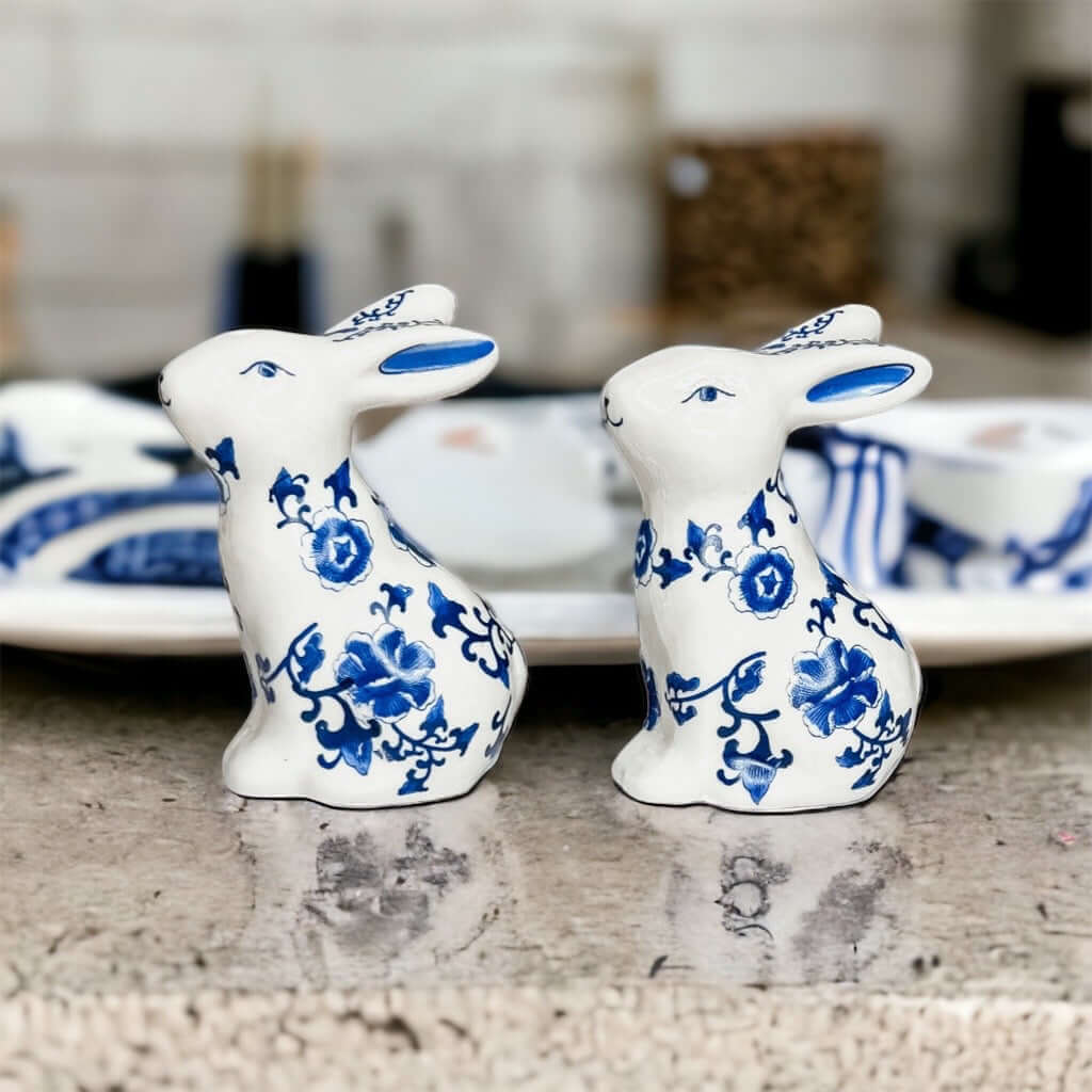 Blue Bunny Shakers ceramic salt and pepper shakers in blue and white floral design, displayed on a counter.