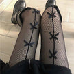 Fishnet Stockings with Bow Detailing | White & Black Lace-Up Hosiery