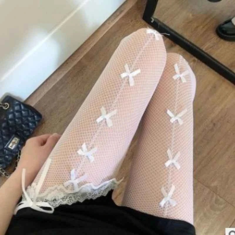 Fishnet Stockings with Bow Detailing | White & Black Lace-Up Hosiery