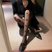 Fishnet Stockings with Bow Detailing | White & Black Lace-Up Hosiery
