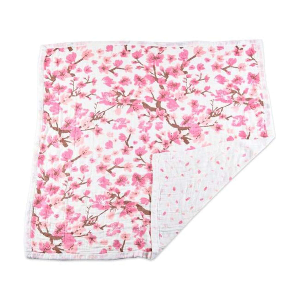 Cherry Blossom muslin blanket featuring delicate pink floral design, perfect for wrapping babies in softness.