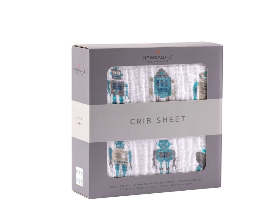 Colorful cotton crib sheet featuring robot designs, packaged in a stylish box.