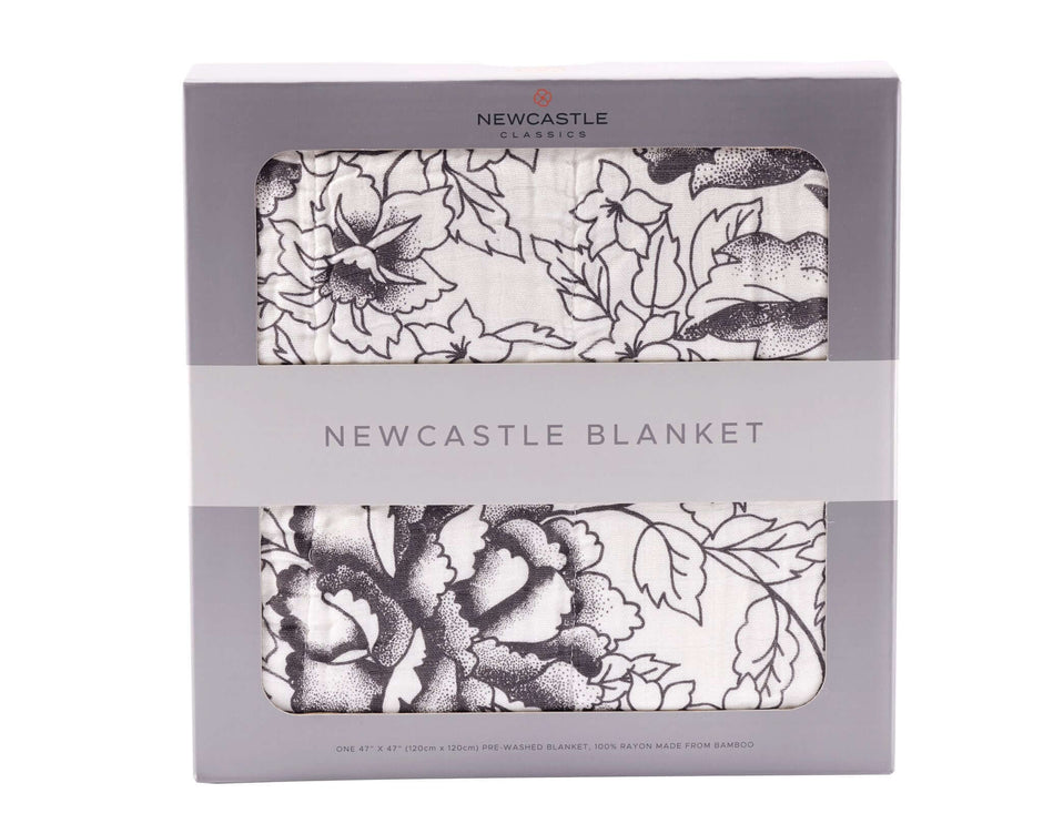 American Rose Newcastle Blanket packaging with floral design, ideal for cozy home decor and warmth.