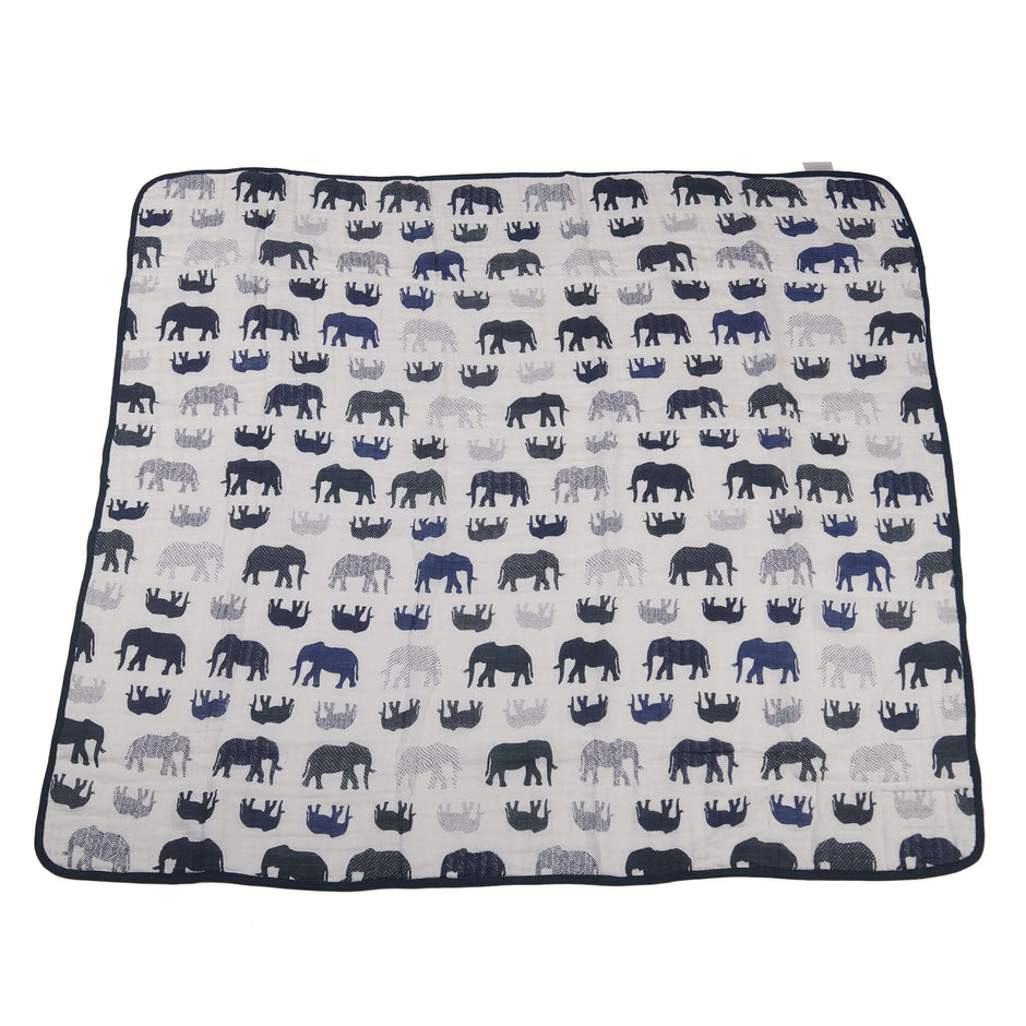 Blue elephants blanket featuring various elephant patterns on a neutral background, perfect for décor and comfort.