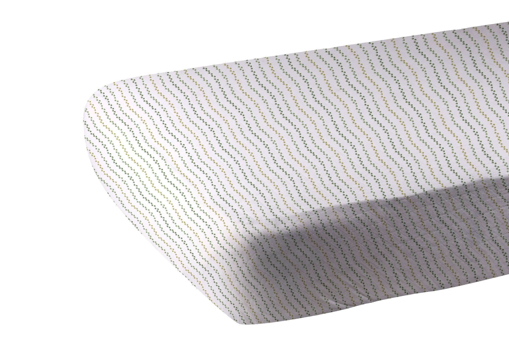 Dino Feet Crib Sheet featuring a colorful wave pattern, perfect for a stylish nursery.