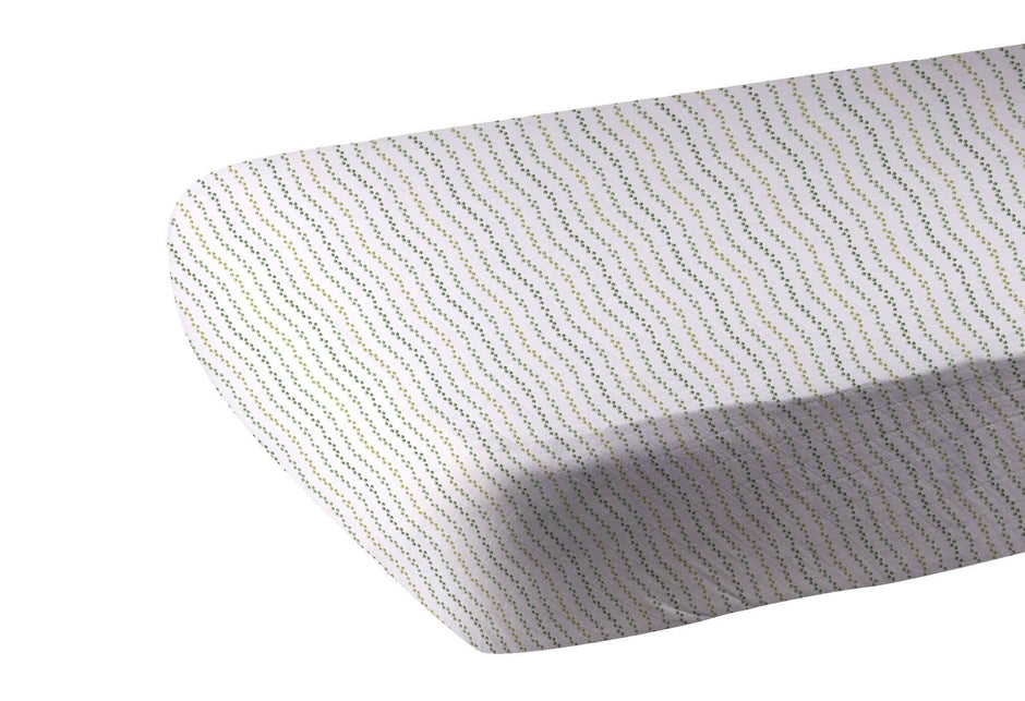 Dino Feet Crib Sheet featuring a colorful wave pattern, perfect for a stylish nursery.