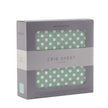 Jade Polka Sheet in box showing white polka dots on a soft green background for crib bedding.