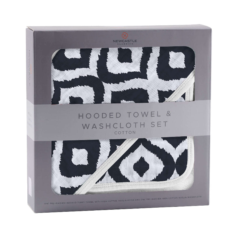 Moroccan hooded towel and washcloth set featuring a stylish black and white geometric design in a gift box.