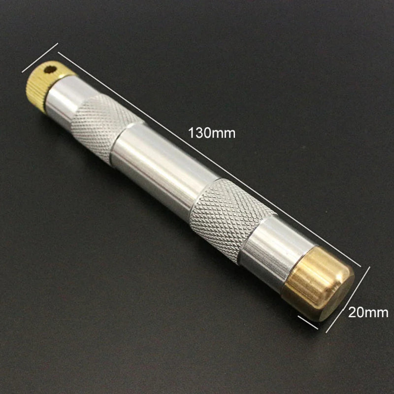 Portable Metal Fire Piston with Brass-Coloured Rod and Knurled Grip for Camping Survival