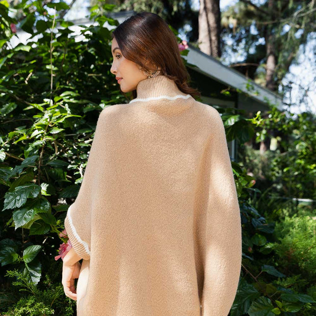 Ponchos à col roulé avec manches.