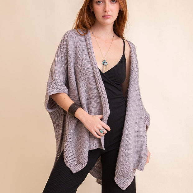 Ruanas en tricot côtelé.