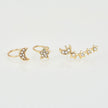 Conjunto de pendientes y brazaletes con forma de luna y estrella