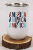 Patriotic USA Bolt Tumbler featuring the word 'America' in vibrant colors on a wooden surface.