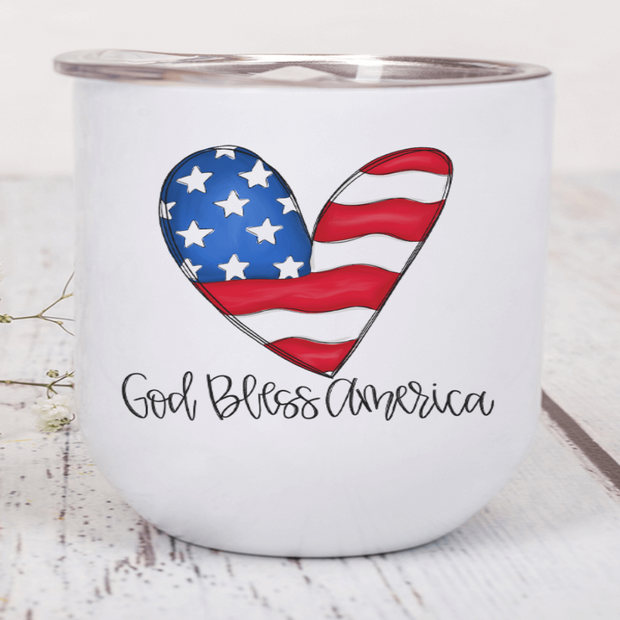 Patriotic heart wine tumbler showcasing the American flag and the phrase 'God Bless America' for patriotic celebrations.