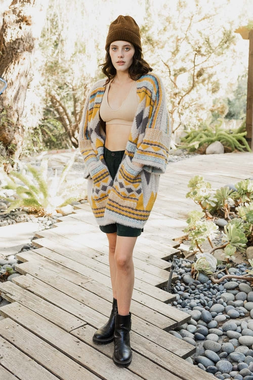 Ruanas de bolsillo de pelo sintético.