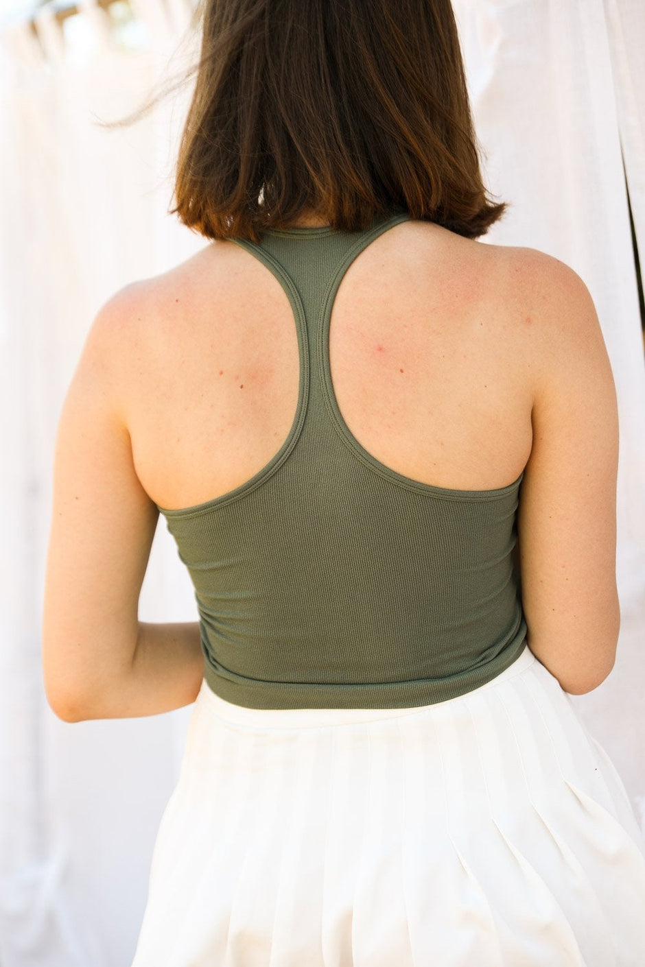 Bramis - Camiseta de cuello alto y espalda cruzada.