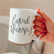 Liquid Therapy Mug-16oz held in hand, featuring a sleek design for comfort in every sip.