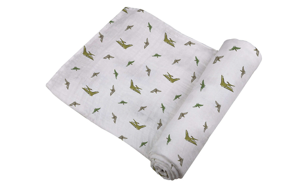 Pteranodon Cotton Swaddle featuring playful dinosaur prints in soft breathable muslin for baby comfort.