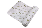 Pteranodon Cotton Swaddle featuring playful dinosaur prints in soft breathable muslin for baby comfort.