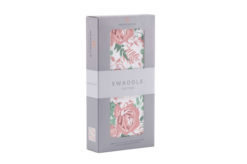 Desert Rose Swaddle packaged in a box featuring a floral design with pink roses, perfect for baby's comfort.