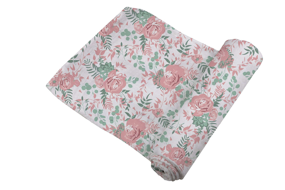 Desert Rose Swaddle featuring a beautiful rose design, soft and breathable fabric for cozy baby comfort.