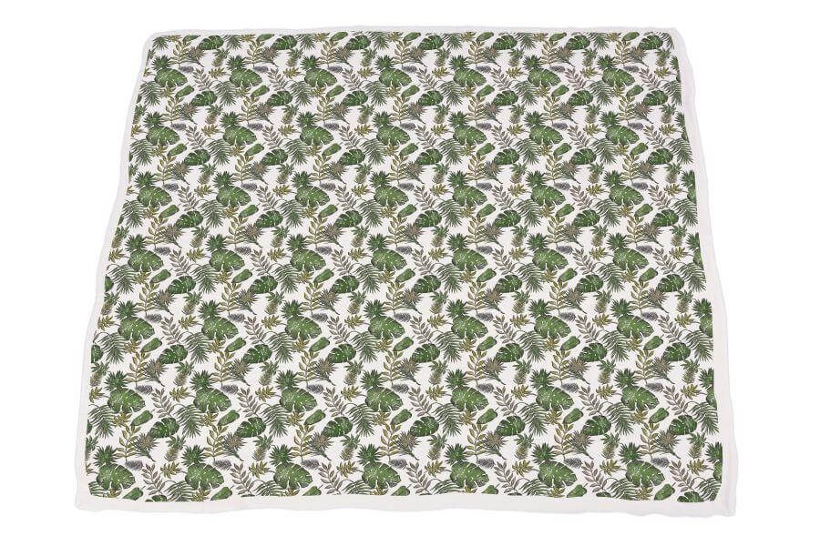 Dino Days Newcastle Blanket featuring a colorful dinosaur and foliage pattern on a soft fabric.