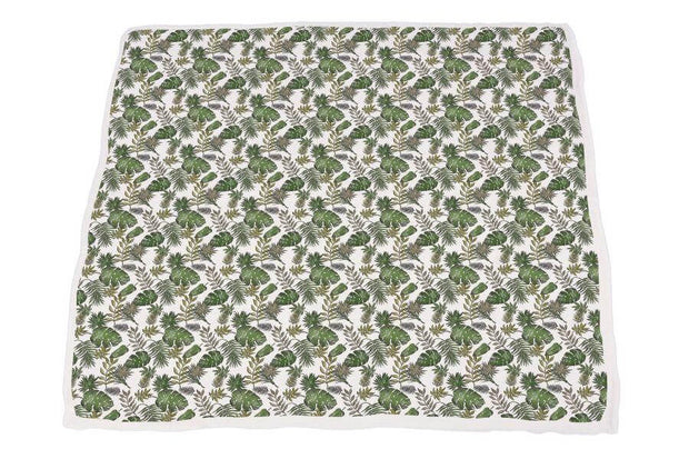 Dino Days Newcastle Blanket featuring a colorful dinosaur and foliage pattern on a soft fabric.