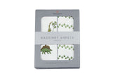 Dino Cotton Pad featuring playful dinosaur prints in a boxed set of cotton bassinet sheets.