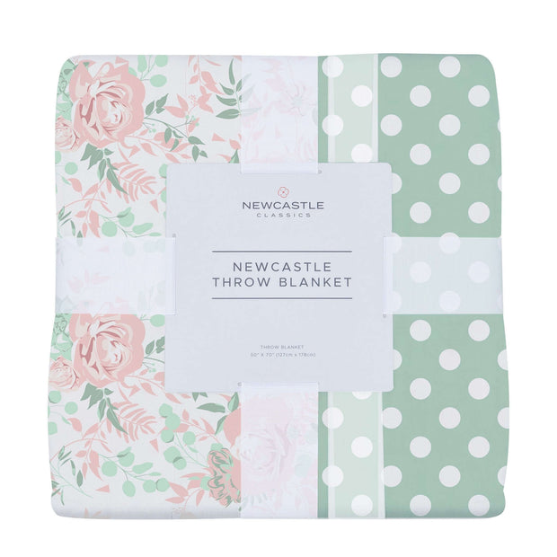 Newcastle throw blanket featuring floral design and polka dots, perfect for cozy aesthetics.