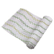 Dino Feet Cotton Muslin Swaddle featuring green and yellow dinosaur footprints on soft cotton fabric.