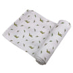 Pteranodon Cotton Swaddle with playful dinosaur prints for babies, perfect for naptime and bedtime.