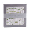 Dino Feet Muslin Blanket in a stylish box featuring dinosaur footprints and green designs.