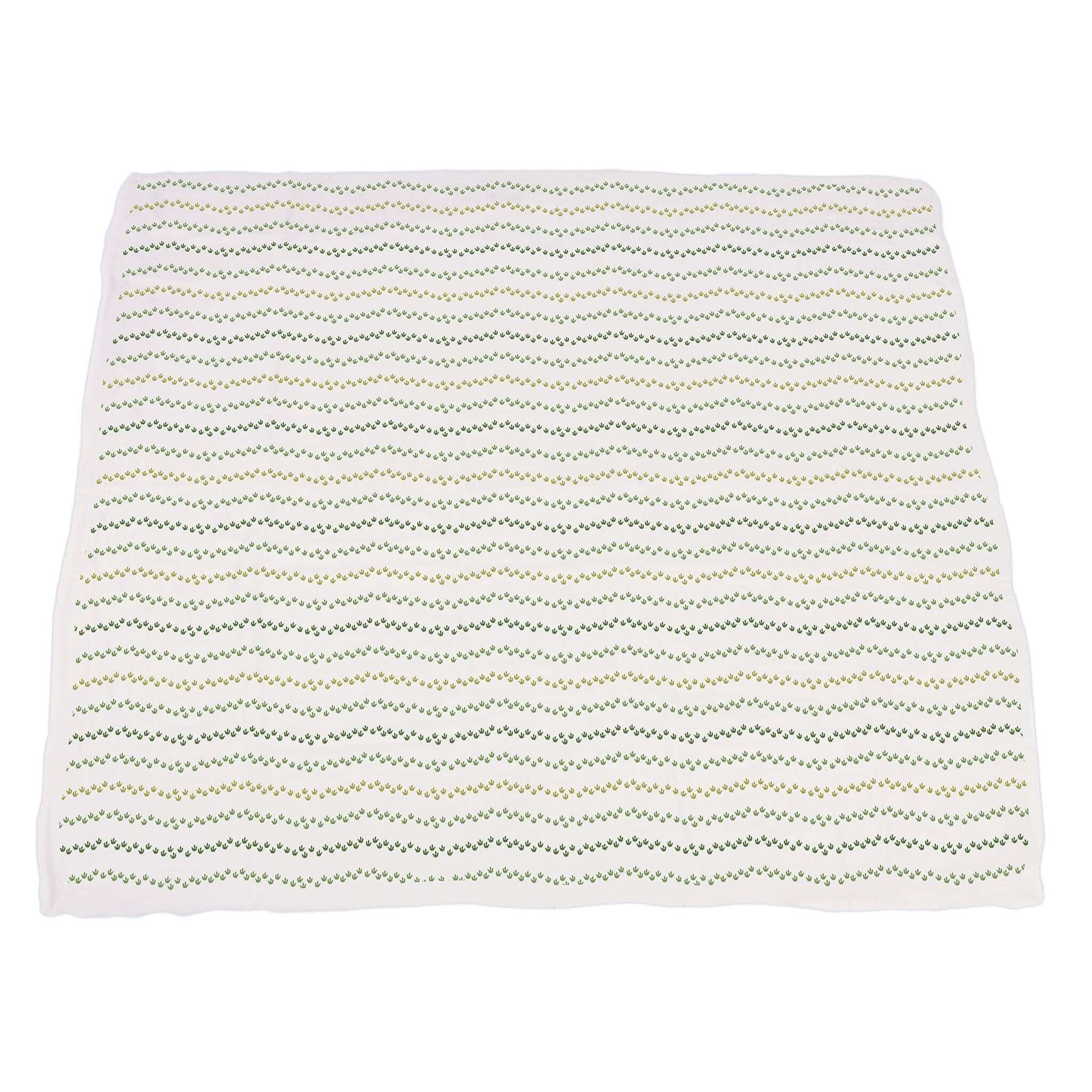 Dino Feet Muslin Blanket featuring a soft, patterned design with a green and white chevron style for cozy comfort.