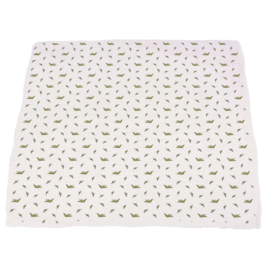 Dino Feet Muslin Blanket with green dinosaur patterns on a white background, perfect for baby soft comfort.