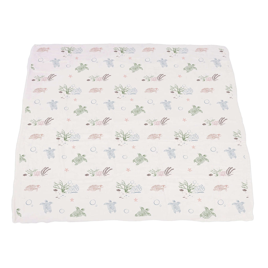Turtles Lily Blanket featuring a soft bamboo muslin design with turtles and water lilies, perfect for babies.