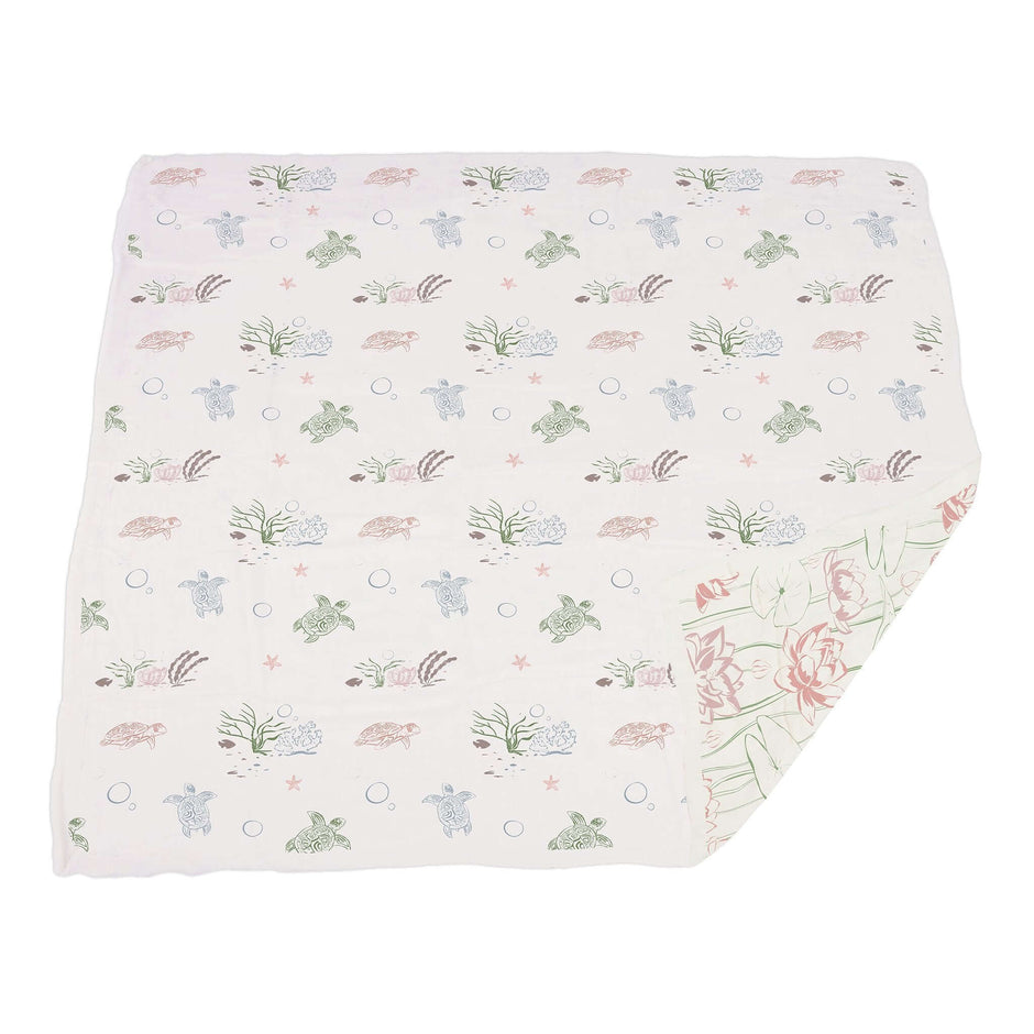 Turtles Lily Blanket featuring soft turtles and water lily designs on breathable bamboo muslin fabric.